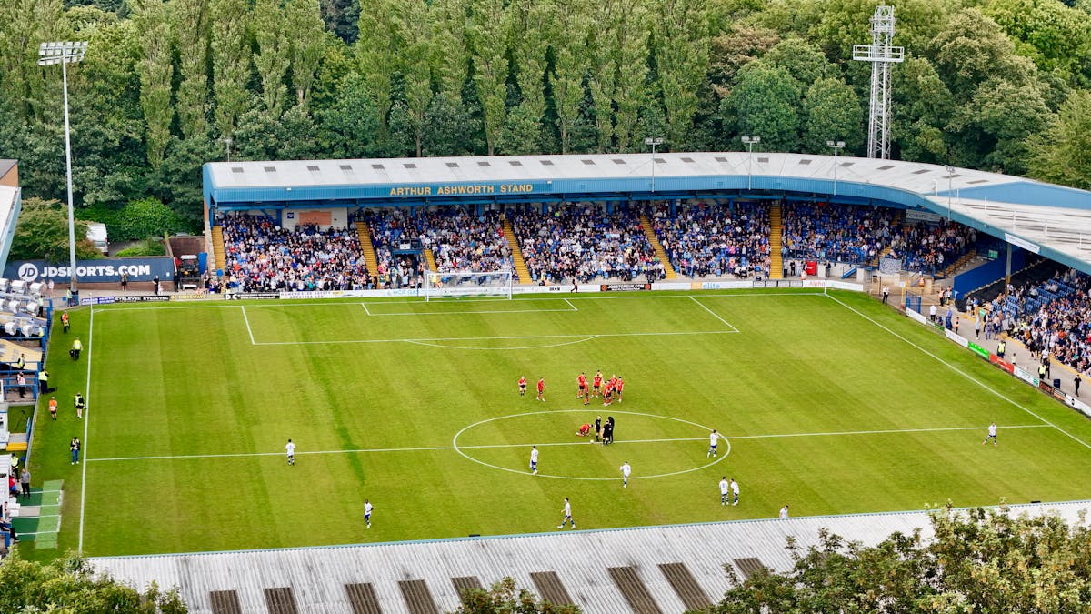 An aerial view of a football match in progress at Bury
